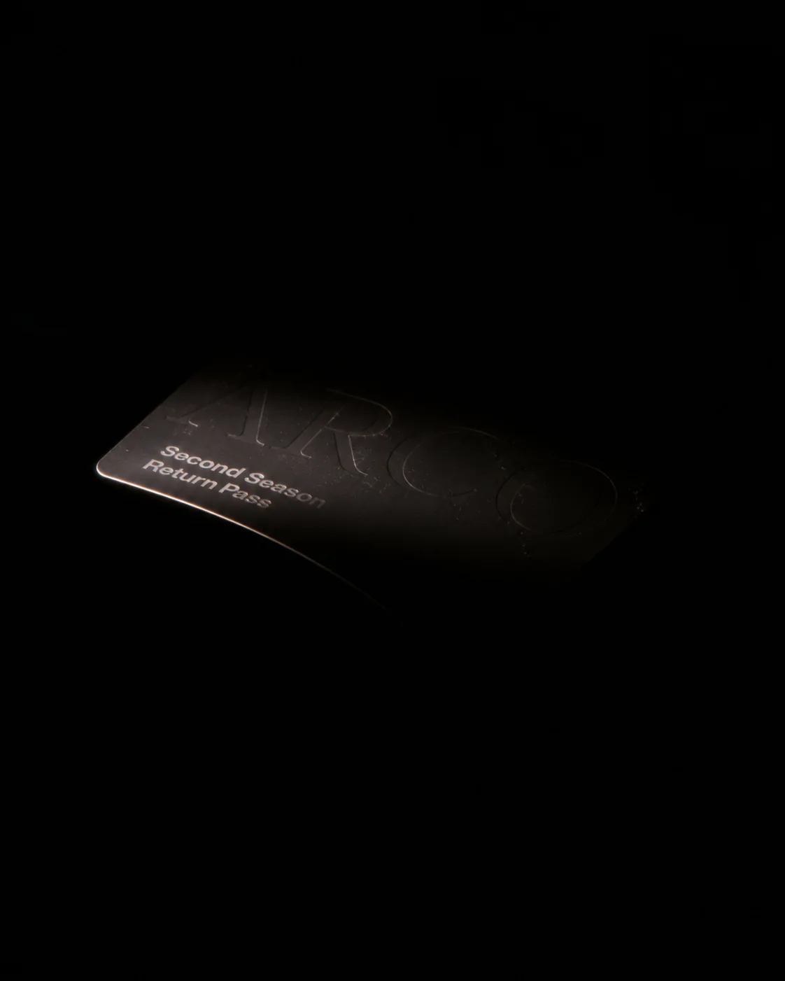 Dark ARCO card marked Second Season Return Pass emerging from the darkness.